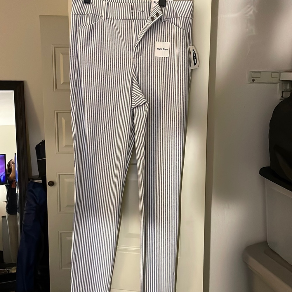 High rise White and blue striped dress pants. Never worn before come with tags.